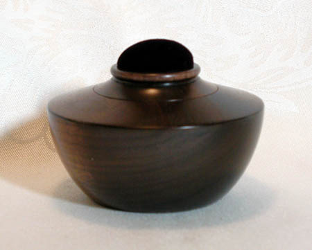 Walnut, oriental style, 4" D x 2.25" H, picture loses beauty of wood, $75.00